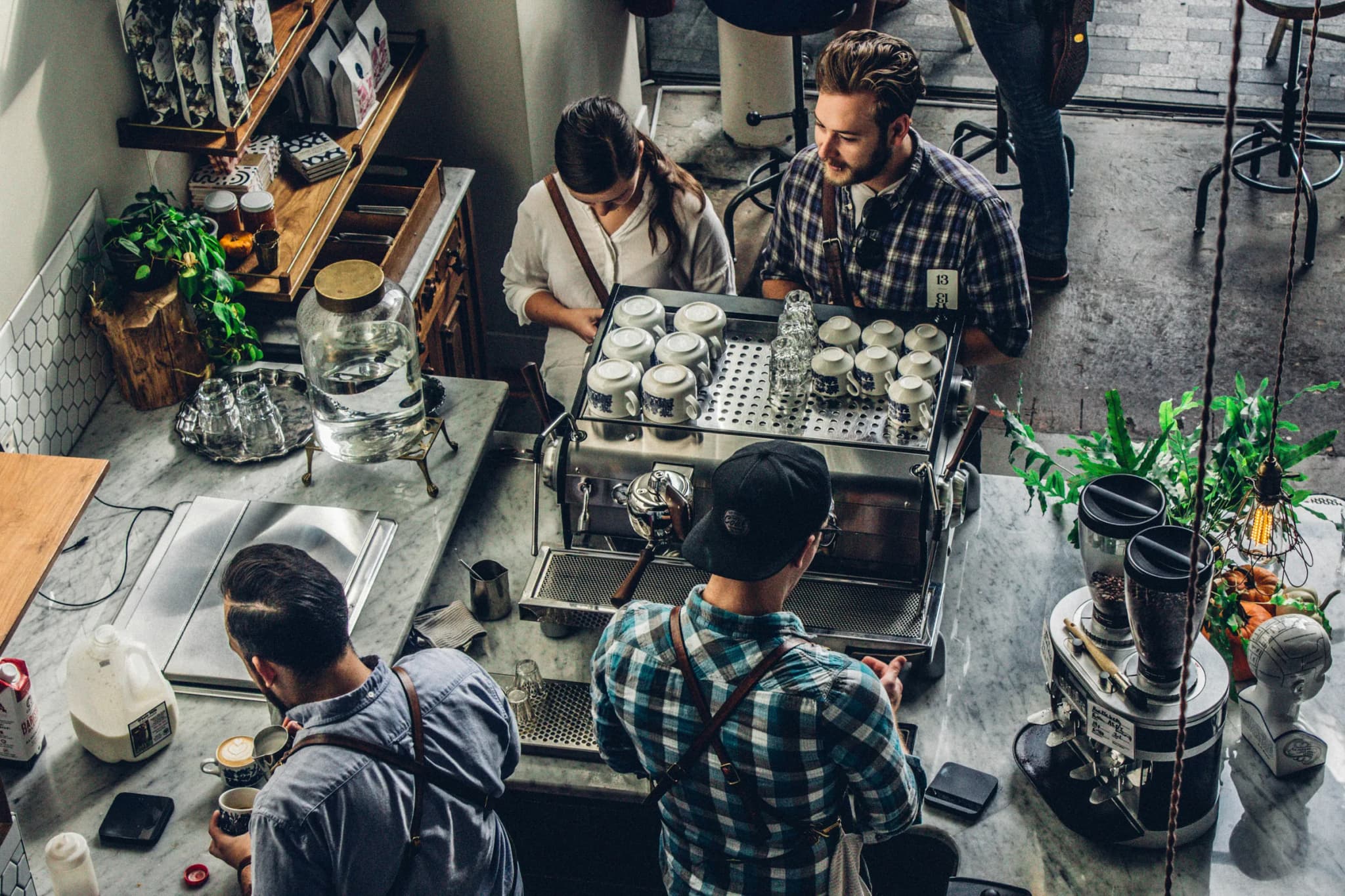 A busy coffee bar mid-service, seen from above